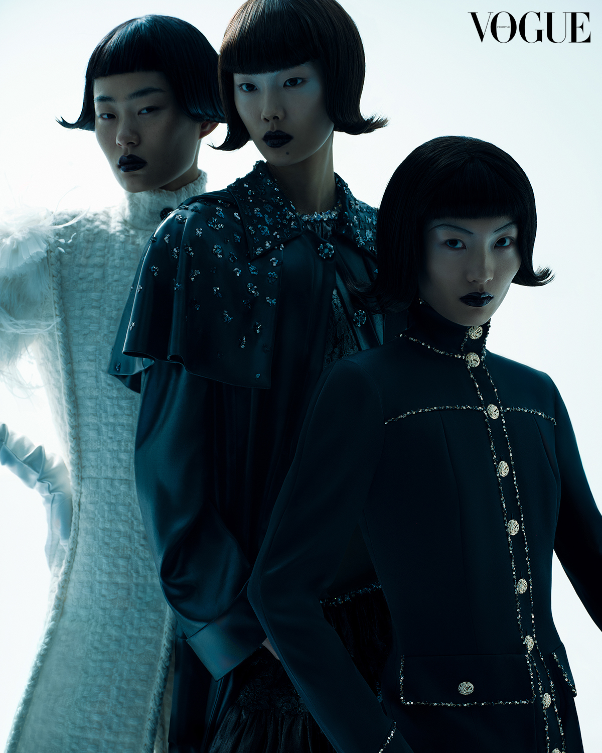 Dark Vogue fashion editorial with three models in embellished black looks