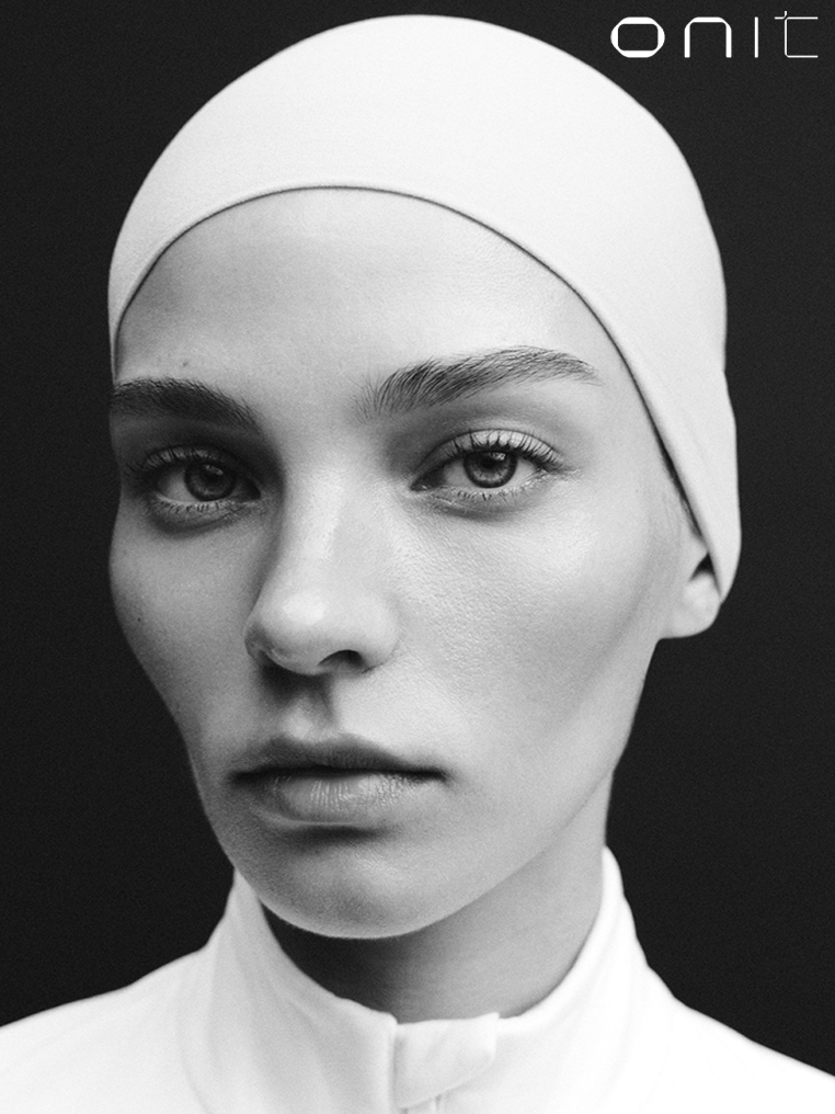Black and white beauty portrait of a model in a white head covering